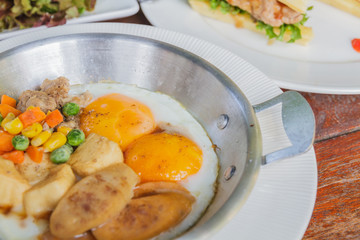 Breakfast: Fried egg add sausage, pork, string bean, corn and ca