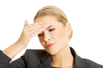 Businesswoman having huge headache