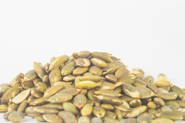 Pumpkin seeds on white blackgroud