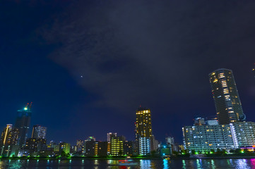 Fototapeta na wymiar Tokyo riverside cityscape at night.