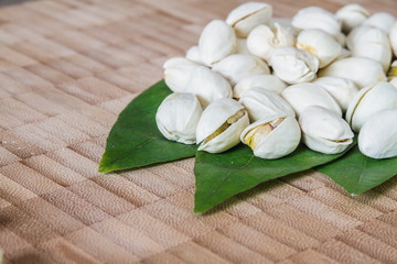 Pistachios on wood table.