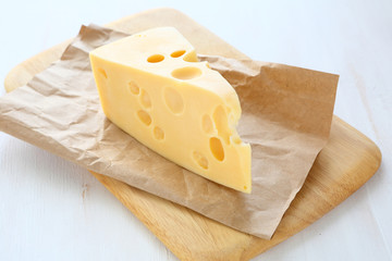 Swiss cheese on a cutting board