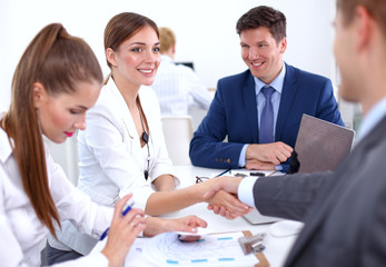 Fototapeta premium Business people shaking hands, finishing up a meeting