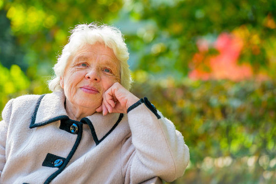 Portrait of pensive older ladies in a coat