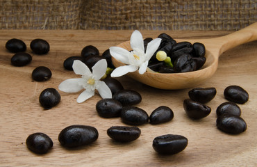 coffee bean in sack on wooden table