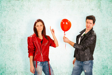 Handsome Man Giving Red Balloon to Woman