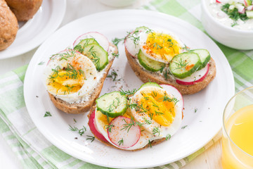 buns with boiled egg and vegetables, top view