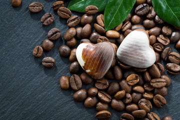coffee beans and chocolate candies in a heart shape