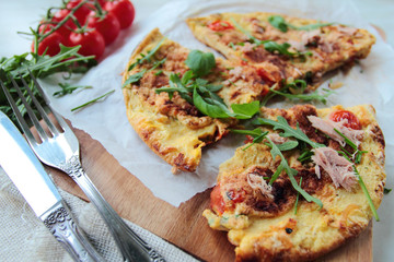 Fresh eggs omelet with tomatoes and rucola salad leafs