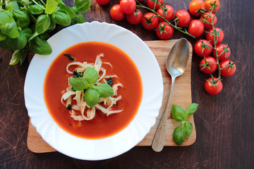 Plate with tomato soup with homemade macaroni