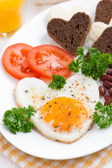 fried eggs in the form of heart for breakfast Valentine's Day