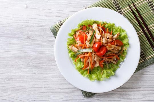 warm salad with chicken and vegetables horizontal top view