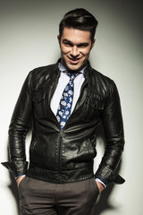 business man holding both hands in his pocket