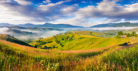 Colorful summer morning in the Carpathian mountain village.