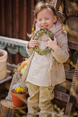 adorable happy child girl in early spring garden with frame