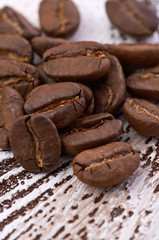 Coffee beans on wood background