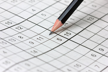 crossword sudoku and pencil, popular puzzle game with numbers