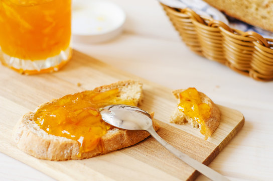 Orange Marmalade Spread Spoon On Homemade Fresh Bread