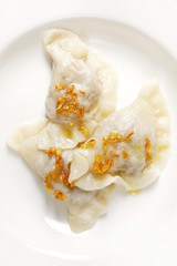 Boiled dumplings filled with mushrooms and cabbage