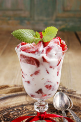 Strawberry smoothie decorated with mint leaf