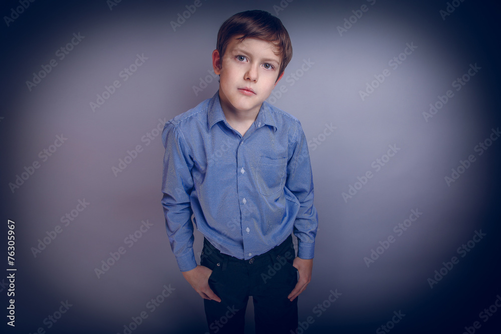 Wall mural Portrait of a boy adolescence European appearance Brown cross pr