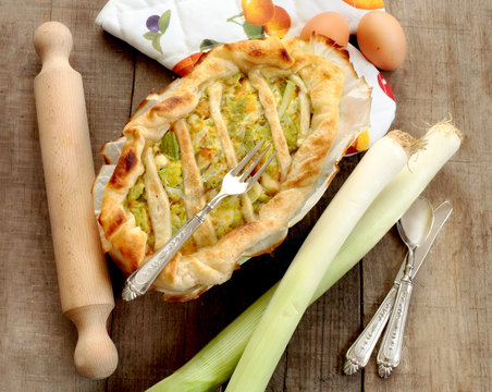 quiche with leeks, vintage silverware and rolling pin