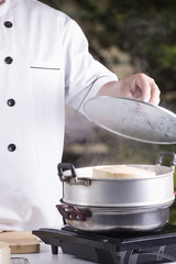 chef opening the pot