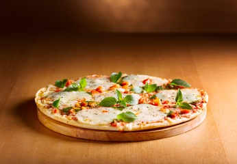 pizza with mozzarella and green basil