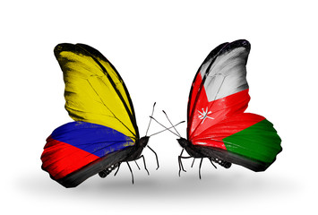 Two butterflies with flags Columbia and Oman