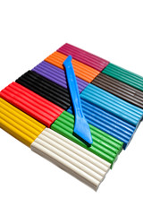 Multicolor plasticine blocks witch stick background