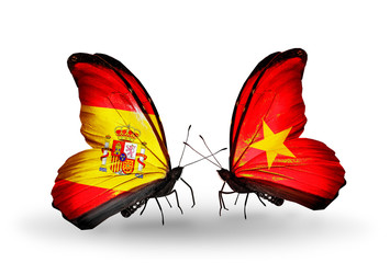 Two butterflies with flags Spain and Vietnam