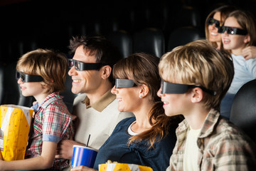 Happy Families Watching 3D Movie In Theater