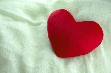 Love heart gift on white fabric