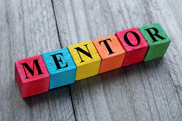 word mentor on colorful wooden cubes