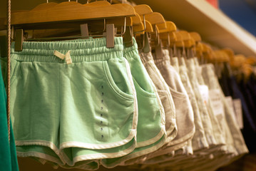 women's shorts hanging in trendy boutique