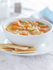 chicken noodle soup with crackers and copysapce composition