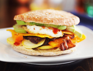 healthy breakfast sandwich with egg, bacon, avocado