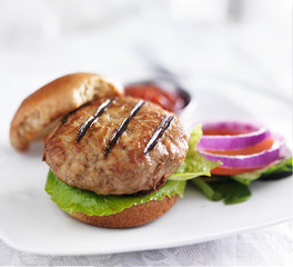 turkey burger on bun with lettuce and fixings