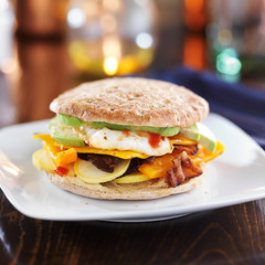 healthy breakfast sandwich with egg, bacon, avocado
