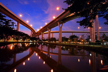 Fototapeta premium Bhumibol Bridge with skyline reflection at twilight in Bangkok