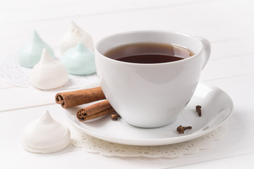 Cup of black tea with homemade meringue