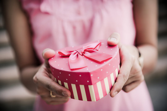 Woman hands holding a gift