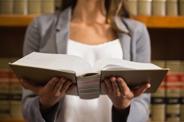 Lawyer reading in the law library