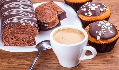 sweet chocolate cupcakes with a roll