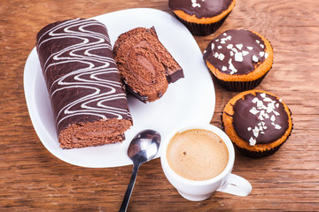 sweet cupcakes with a roll