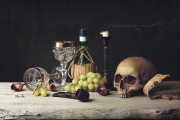 Vanitas witch Skull; Pipe, tobacco, dice; wine glass, wine and g