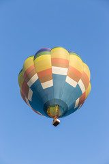 Hot air balloon on blue sky background
