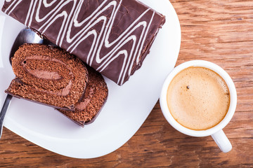 sweet roll with a cup of coffee close-up