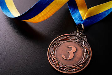 Bronze medal on a dark background