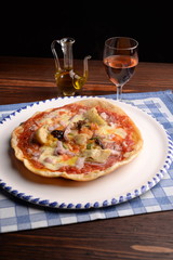 Pizza with artichokes and bacon